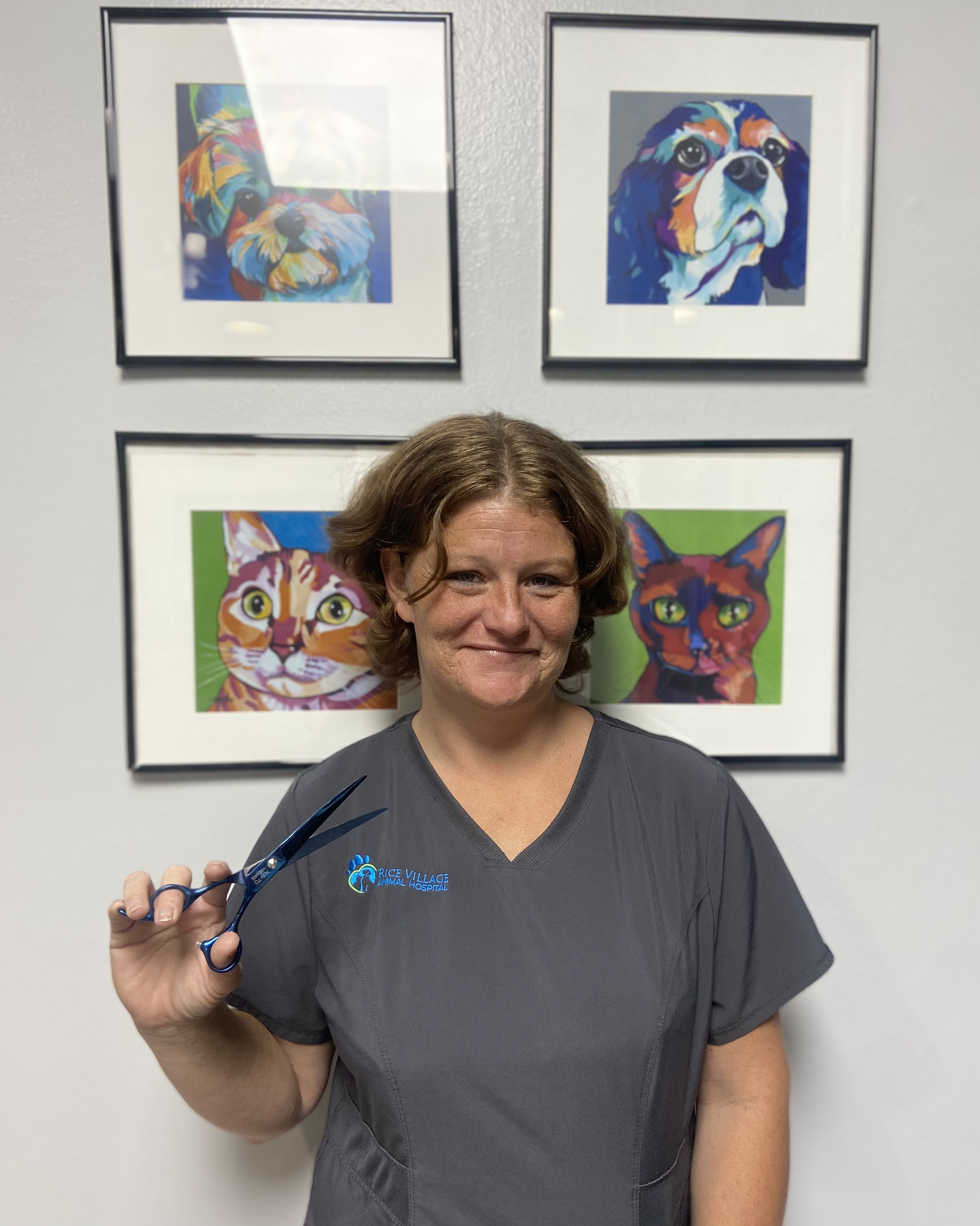 Portrait of pet groomer holding scissors